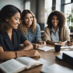 Three women sitting at a table smiling during study group.