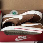 Pair of brown Nike court legacy next nature in Nike shoe box