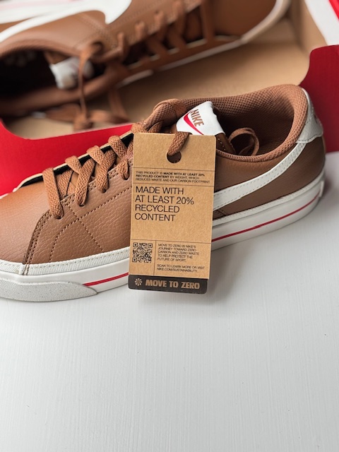 Brown Nike Court Legacy Next Nature showing Move to Zero tag