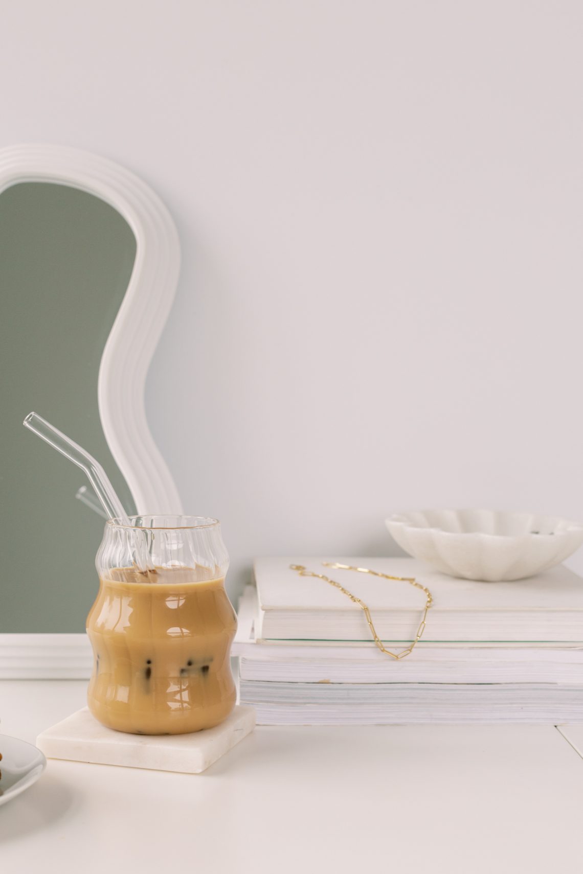 Picture of a glass of bubble tea sitting on a white table