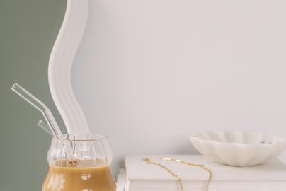Picture of a glass of bubble tea sitting on a white table