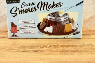 A box for the Nostalgia Electric S’mores Maker for making s’mores at home during family movie night.