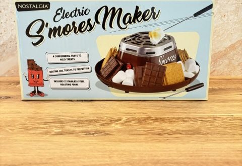 A box for the Nostalgia Electric S’mores Maker for making s’mores at home during family movie night.